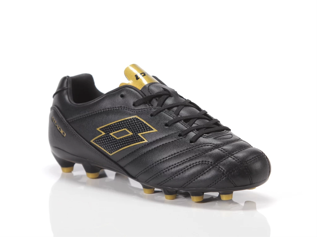  Stadio 705 FG JR - Calcio ragazzo Lotto. Disponibile in diverse taglie: 37, 38 e colori oro, nero. YOUSPORTY.